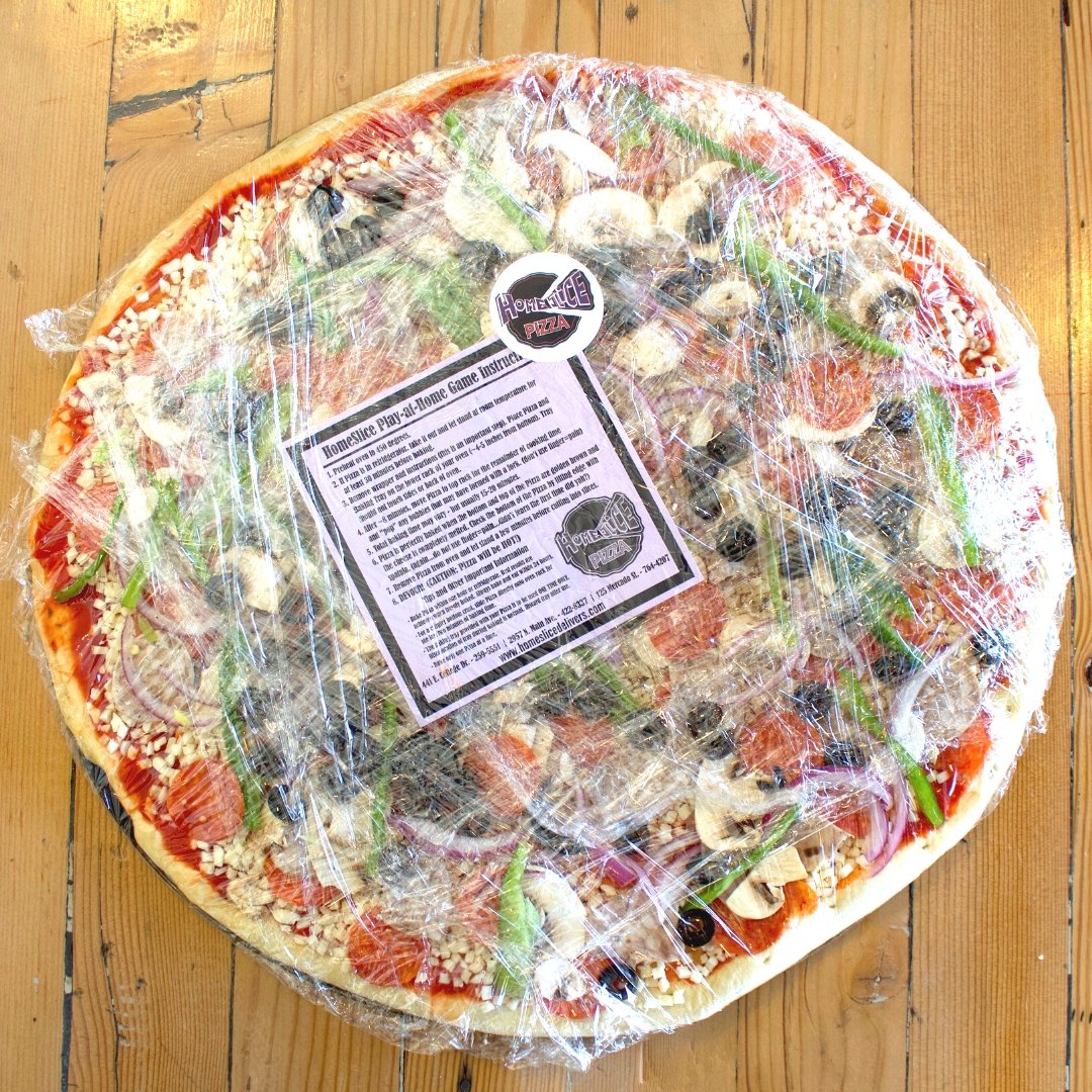 A HomeSlice Take & Bake pizza, wrapped and ready to bake at home