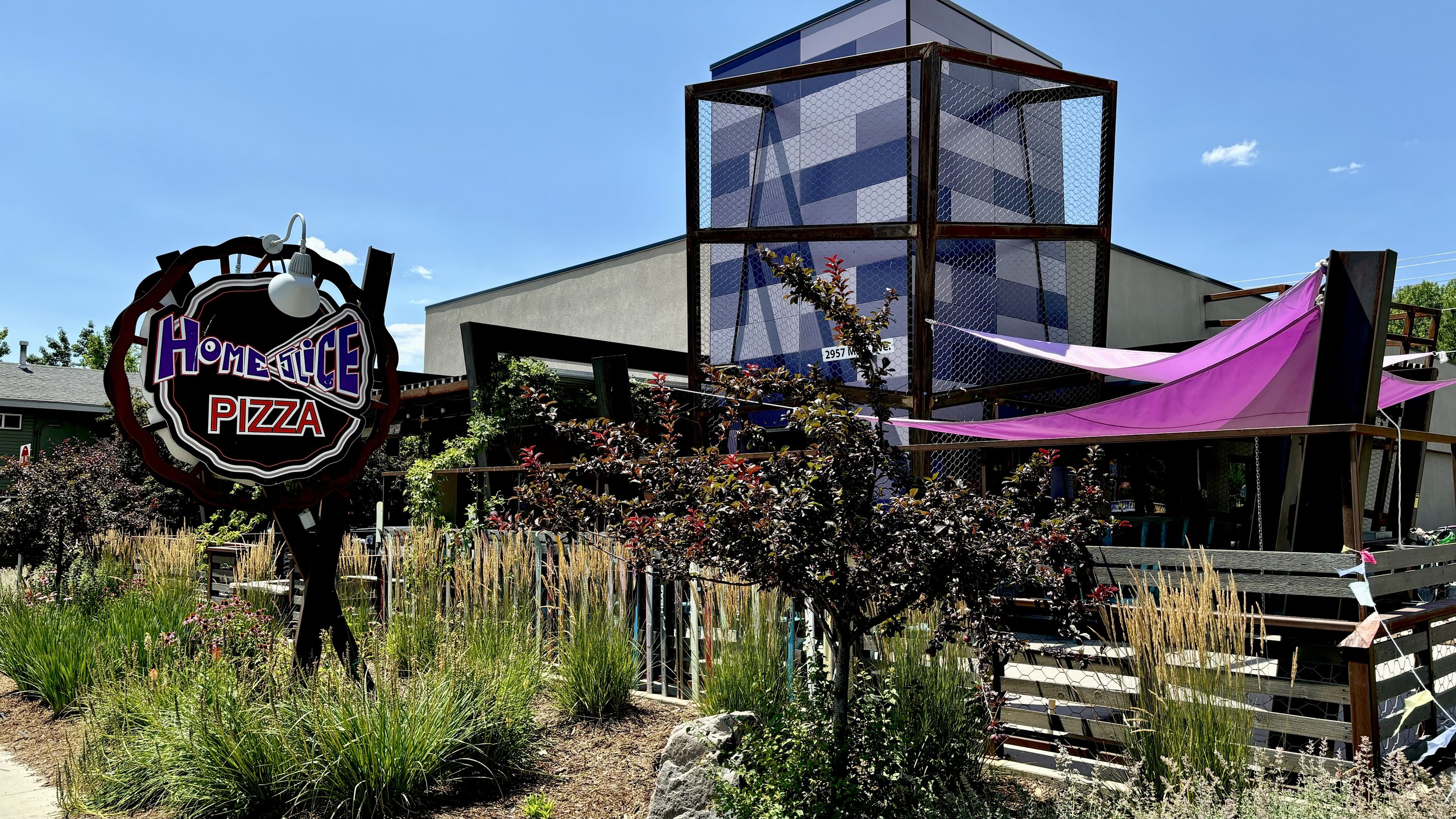 The exterior sign at HomeSlice Pizza North Main