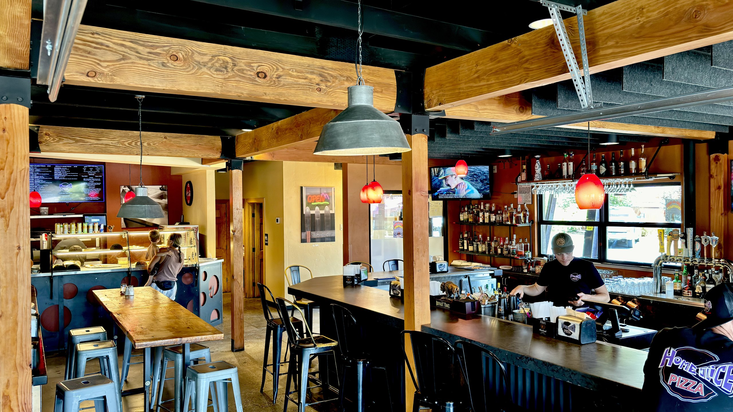 The lively dining room and full bar at HomeSlice Pizza North Main