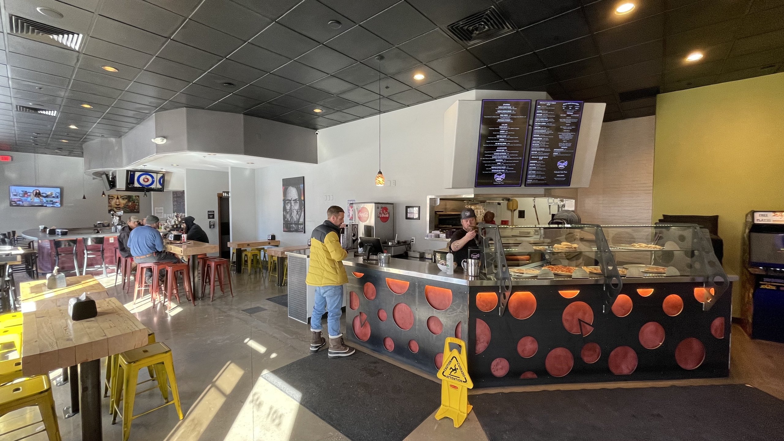 The coral polka-dot counter front at HomeSlice Pizza Three Springs
